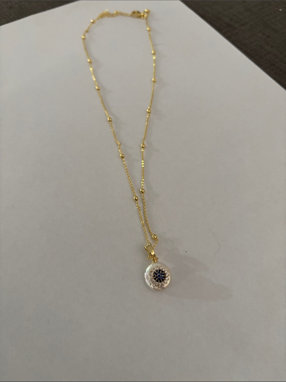 Gold Beaded Chain Necklace with Blue Crystal Disc Pendant
